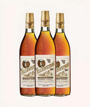 Three bottles of Yellowstone Bourbon Whiskey on a white background