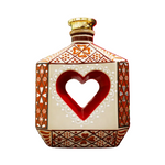Decorative bottle with a heart design on a white background